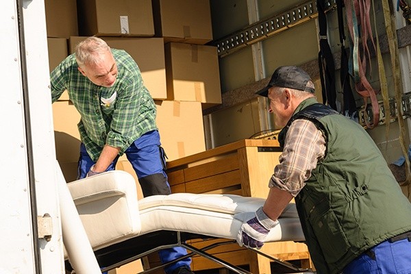 Collegian's Local CT Movers packing office furniture into a truck