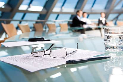 Office team working at a table during a commercial move managed by Collegian Movers
