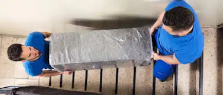 Collegian Movers' movers carrying furniture