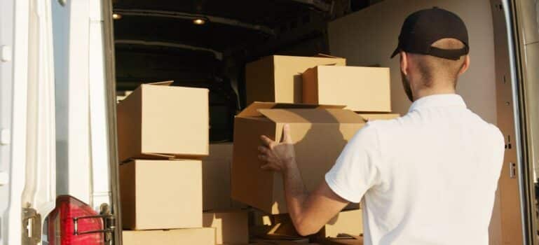 A man putting boxes into van and waiting for movers Fairfield CT