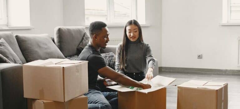 A couple packing boxes and waiting for movers Fairfield CT