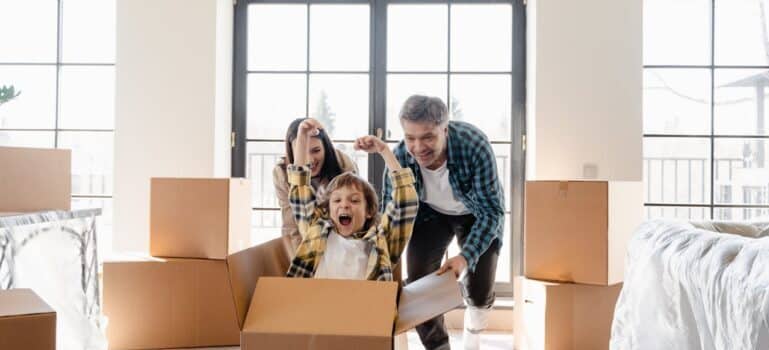 A happy family after moving into their new home with movers Cheshire CT