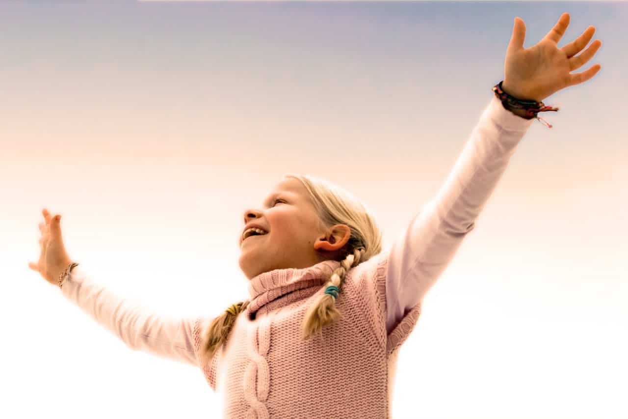A kid with raised hands