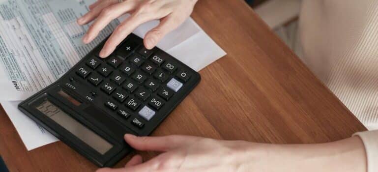 woman using calculator