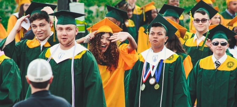 Students celebrating their graduation. 