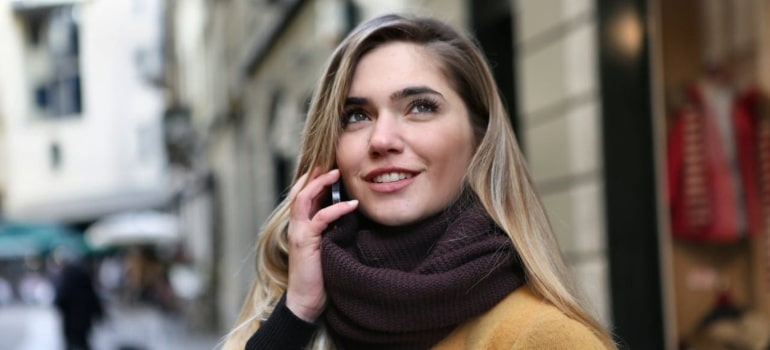 Happy woman talking on  the phone 