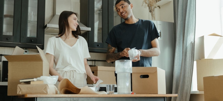 Happy couple getting their items ready for household storage