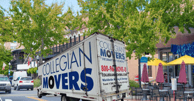 Collegian Movers truck making a local move on a downtown Westport Connecticut street.