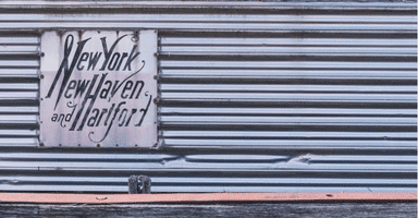 Side view of a train with a sign reading New York, New Haven and Hartford.