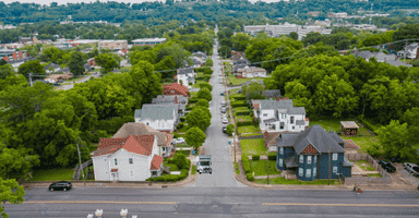 Ariel view of a New Haven neighborhood with a Collegian Movers truck parked in front of a home.
