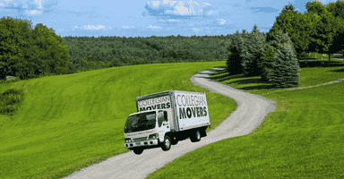Collegian Movers moving truck driving down a farm road